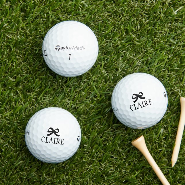 Personalised black bow Taylor Made golf balls (Insitu Grass)