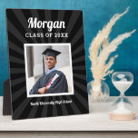 Personalised Black Class of 2025 Graduation Photo Plaque<br><div class="desc">Modern and minimal plaque display sign with easel for the graduation party will showcase your graduate! Design features a square photo of the grad framed in white with simple and classic first name, class year, and school name wording that can be personalised. Includes a subtle starburst pattern. Black background colour...</div>