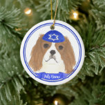 Personalised Blenheim Cavalier Hanukkah Yarmulke Ceramic Tree Decoration<br><div class="desc">Celebrate your favourite mensch on a bench with personalised ornament! This design features a sweet illustration of a red and white or blenheim cavalier king charles spaniel dog with a blue and white yarmulke. For the most thoughtful gifts, pair it with another item from my collection! To see more work...</div>