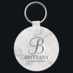 Personalised Bridesmaid's Name and Monogram Key Ring<br><div class="desc">Elegant Personalised Bridesmaid Gifts featuring personalised monogram in grey elegant script font style with bridesmaid's name and title in classic serif font style on white marble background. Also perfect for groomsmen, best man, father of the bride, maid of honour, flower girl, mother of the bride and more. Please note: The...</div>