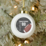 Personalised Chalkboard American Football Ceramic Ball Christmas Ornament<br><div class="desc">A modern American football grid iron design featuring a football on a chalkboard typography background with football terminology in the background. The design features customisable text for the name and number of the football player or grid iron fan. This design has been made in part with graphics licensed by Graphics...</div>