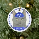 Personalised Chartreux Cat Yarmulke Blue White Ceramic Tree Decoration<br><div class="desc">Celebrate your favourite mensch on a bench with personalised ornament! This design features a sweet illustration of a grey chartreux cat with a blue and white yarmulke. For the most thoughtful gifts, pair it with another item from my collection! To see more work and learn about this artist, visit her...</div>