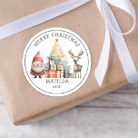Personalised Christmas Gift Classic Round Sticker<br><div class="desc">Add a sprinkle of magic to your Christmas decorating with our delightful personalised stickers. These delightful watercolor images of Santa, a Christmas tree, gifts and a reindeer, come with an added personal touch - your child's initial and name. Instantly transform gift wrappings, cards, and decorations into something truly special, making...</div>