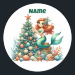 Personalised Christmas Mermaid Circular Sticker<br><div class="desc">Make your holiday season magical with this personalised Christmas mermaid sticker! Featuring a charming mermaid design in a circular style, this sticker can be customised with your child’s name or a special message. Perfect for decorating presents, notebooks, party favours, or adding a festive touch to any gift. Durable, vibrant, and...</div>