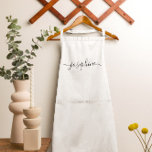 Personalised elegant script name white<br><div class="desc">Hosting a botanical, succulent workshop? How about a cooking class? Give out personalised white aprons for your guests with an elegant font script type that will surely delight them. Have the talking about this sophisticated giveaway. Tip: to keep the long swashes at the end keep the small squares at the...</div>