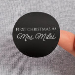 Personalised 'First Christmas as a Mrs.' Surname Classic Round Sticker<br><div class="desc">Celebrate your first Christmas as a Mrs. with a personalised touch. Featuring your new surname,  this elegant design captures the joy of this special milestone. Perfect for adding a festive and meaningful element to your holiday season,  it’s a keepsake that will be cherished for years to come.</div>