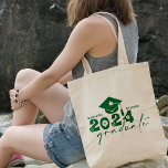 Personalised Graduate Class of 2024 Green Tote Bag<br><div class="desc">Graduate Class of 2024 quote features a cap with tassel,  modern topography and calligraphy script,  accented with florals and hearts.  Easily personalise with your name of choice and monogram on back.  Great gift idea for that special grad.  (School Colour: Green)</div>