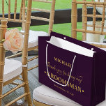 Personalised Groomsman Purple and Gold Thank You Large Gift Bag<br><div class="desc">Personalised groomsman gift bag with purple and gold colour palette. The name template is set up ready for you to add the groomsman's name as well as the bride & groom's names and wedding date. The thank you wording reads "Thank you for being my groomsman" in a blend of elegant...</div>