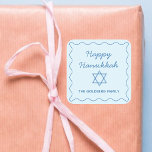 Personalised Jewish Star Blue Happy Hanukkah Gift Square Sticker<br><div class="desc">Add a thoughtful, personal touch to your Hanukkah gifts with these elegant custom stickers. Featuring a soft blue wavy border, "Happy Hanukkah" greeting, and a Star of David, these stickers are a beautiful way to celebrate the holiday season. Customise them with your family name for a unique touch that will...</div>