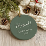 Personalised Married Couple Handwritten Green Ceramic Tree Decoration<br><div class="desc">Celebrate your first Christmas as a married couple with this personalised boho green ceramic ornament. Featuring a charming handwritten script, this ornament beautifully displays the names of the bride and groom, along with the year. The earthy green tone adds a touch of natural elegance, making it a perfect keepsake for...</div>