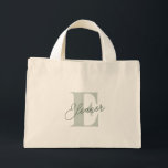 Personalised Monogram Name Sage Green Script Mini Tote Bag<br><div class="desc">This personalised mini tote bag features a stylish sage green script monogram, perfect for bridesmaid gifts. Ideal for weekend getaways, bachelorette parties, or bridal party favours, this chic and practical tote is a thoughtful way to thank your bridesmaids. Whether for the beach or everyday use, this custom tote adds a...</div>
