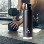 Personalised name monogram black and white water bottle<br><div class="desc">Modern trendy simple minimal black and white masculine stylish water bottle with minimalist typography.            Personalised keepsake gift for him: dad,  father,  husband,  son,  groomsman,  best man,  or friend on birthday,  anniversary,  Christmas,  wedding or any other occasion.</div>