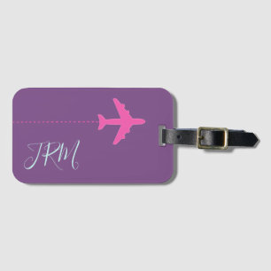 personalised pink aeroplane on purple monogrammed luggage tag