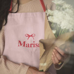 Personalised Pink & Red Bow Name Apron | Custom E<br><div class="desc">Cook in style with this personalised pink and red bow name apron, designed for elegance and functionality. Featuring a chic bow design in soft pink and bold red, this custom apron is the perfect blend of fashion and practicality. Personalise it with your name or initials to make it uniquely yours...</div>