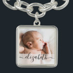 Personalised script name baby photo bracelet<br><div class="desc">Perfect for the new mother,  customise this charm bracelet with her newborn's photo and name. Long tailed script.
Tip: retain the squares on the end of the name to keep the long tailed embellishment on the name.</div>