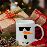 Personalised Snowman with Sunglasses,Christmas Mug<br><div class="desc">This adorable personalised snowman Christmas mug is Great for kids during the holiday season! Ideal for hot chocolate,  this festive mug showcases a cheerful holiday snowman design. Add a personal touch by customising it with a name,  making it a delightful gift for Christmas.</div>
