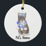 Personalised Tabby Cat (Grey) Blue Ski Hat & Scarf Ceramic Tree Decoration<br><div class="desc">Make the nice list this year with an ornament of your favourite tabby cat elf! For the sweetest gifts, pair it with a matching art print or another item from my collection for a thoughtful housewarming, cat mum, bridal shower, teacher, mother-in-law, husband, boyfriend, secret santa, sympathy, or tough-to-shop-for gift! To...</div>