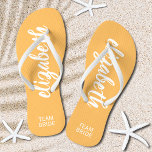 Personalised Team Bride Orange and White Flip Flops<br><div class="desc">Light orange and white - or any colour - flip flops personalised with your name and "Team Bride" or any wording you choose. Great bridesmaid gift, bachelorette party, flat shoes for the wedding reception, or a fun bridal shower favour. Change the colour straps and footbed, too! More colours done for...</div>