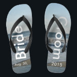 Personalised Wedding Beach Sand Flip Flops<br><div class="desc">Pretty Blue Sky with Light Fluffy White Clouds, Blue Sea, Crashing Ocean Waves and Beach Sand. Unisex Flip Flops with Bride and Groom Date of Marriage written in a white colour text. PERSONALIZE with your text on left and right feet, (or delete text to only show image). The wedding date...</div>