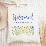Personalised Wildflowers Blue Script Bridesmaid Tote Bag<br><div class="desc">This simple,  elegant tote bag features a border of wildflowers in shades of yellow and blue with green stems. The word "bridesmaid" appears in blue handwriting script. Personalise it with her name in sans serif font. Makes a perfect bridesmaid gift!</div>