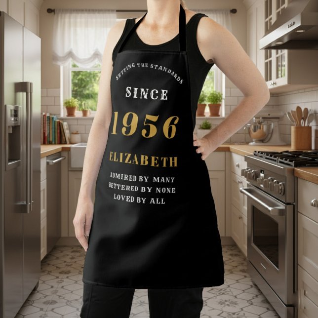 Personalized 70th Birthday 1956 Black & Gold Apron (birthday 1956 apron worn in a kitchen.)
