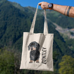 Personalized Dachshund Pet Name | Cute Doggy Goody Tote Bag<br><div class="desc">This adorable tote bag features a personalized name and a cute dachshund dog design. It's perfect for carrying around all your shopping essentials, or for using as a pet carrier. The strong and sturdy fabric will hold up to wear and tear, and the bag is machine washable for easy care....</div>