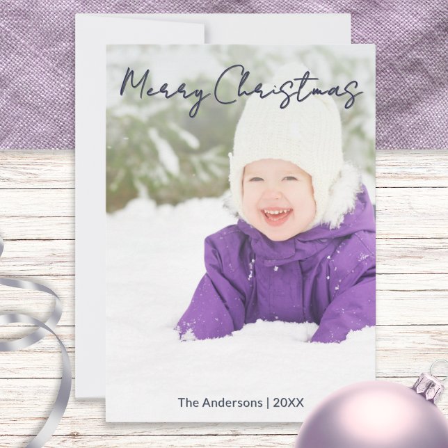 Personalized Family Photo Simple Minimalist Holiday Card (A holiday card with script 'Merry Christmas' and custom photo, with family name and year)