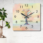 Personalized Rainbow Tree Square Wall Clock<br><div class="desc">This colorful Wall Clock is decorated with a mosaic family tree in the colors of the rainbow on a watercolor background.
Easily customizable with your name.
Because we create our own artwork you won't find this exact image from other designers.
Original Mosaic and Watercolor © Michele Davies.</div>