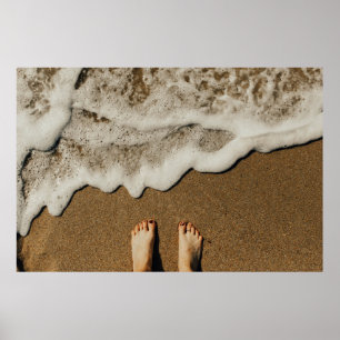 Person's feet on seashore poster
