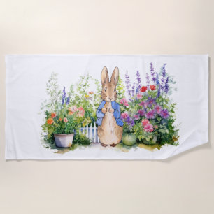 Peter the rabbit in his flower garden beach towel