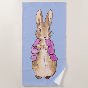 Peter the rabbit with a blue background beach towel