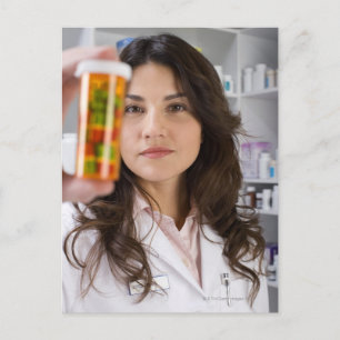 Pharmacist holding a pill bottle postcard