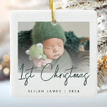 Photo Baby's First Christmas Green Script Ceramic Ornament<br><div class="desc">Celebrate baby's first Christmas with this modern minimalist photo keepsake ornament. The dark green text reads "1st Christmas" in trendy handwriting script. Easily replace the sample image with your favourite photo,  and add baby's name and the year below. A white gradient screen helps make the text overlay pop.</div>