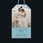 Photo, Dusty Blue Leaves Wedding Save the Date Gift Tags<br><div class="desc">Delight your guests announcing your wedding date with a gift; they will love hearing the news and enjoy the nice detail! Photo gift tag with attractive watercolor dusty blue coloured leaves photo overlay on the top framing your photograph. Dusty blue section on the bottom with modern hand written calligraphy details,...</div>