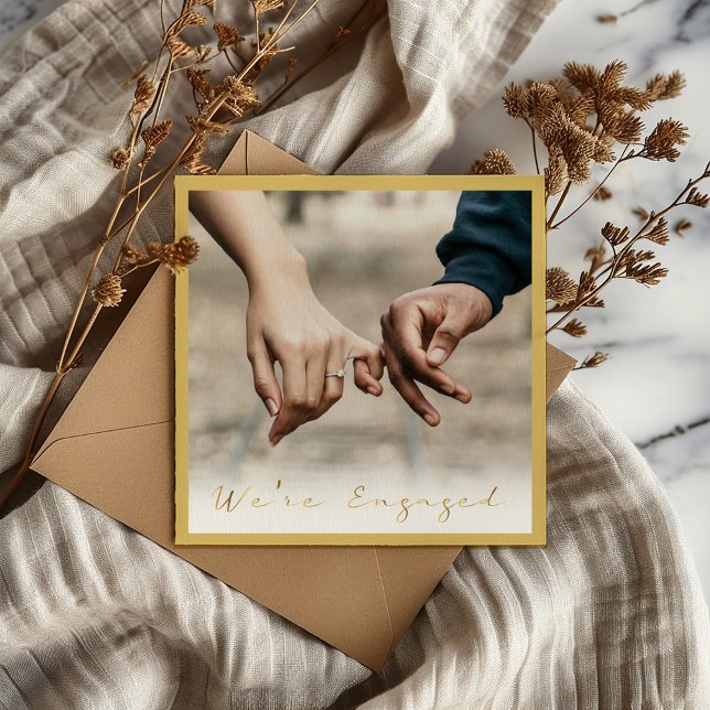 Photo gold script engaged announcement party (A thin border. "We're Engaged" written in a modern gold effect script and photo)