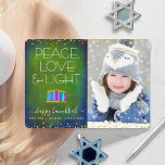 Photo Green Hanukkah Menorah Peace Love Light Type Holiday Card<br><div class="desc">“Peace, love & light.” A playful, modern, artsy illustration of boho pattern candles in a menorah helps you usher in the holiday of Hanukkah, along with the custom photo of your choice. Assorted blue candles with colourful faux foil patterns overlay a rich, deep green blue textured background. Faux gold foil...</div>