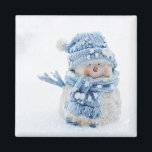 Photo of a Cute Snowman in Winter - Christmas Magnet<br><div class="desc">A magnet with a cute photograph of a little snowman. Standing outside in the winter with snow falling all around. This cute little guy is dressed up in blue knitted hat and scarf.</div>