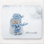 Photo of a Cute Snowman in Winter - Christmas Mouse Mat<br><div class="desc">A mouse pad with a cute photograph of a little snowman. Standing outside in the winter with snow falling all around. This cute little guy is dressed up in blue knitted hat and scarf.  Personalise with a name.</div>