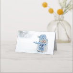 Photo of a Cute Snowman in Winter - Christmas Place Card<br><div class="desc">A place card with a cute photograph of a little snowman. Standing outside in the winter with snow falling all around. This cute little guy is dressed up in blue knitted hat and scarf.</div>