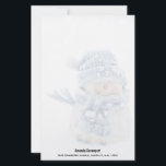 Photo of a Cute Snowman in Winter - Christmas Stationery<br><div class="desc">Stationery paper with a cute photograph of a little snowman. Standing outside in the winter with snow falling all around. This cute little guy is dressed up in blue knitted hat and scarf. A semi-transparent layer on top so the image is faded and easy to write on top. Personalised name...</div>