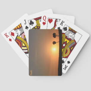Photo of a sunset on the beach playing cards