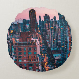 PHOTO OF HIGH-RISE BUILDINGS WITH BLUE AND PINK SK ROUND CUSHION
