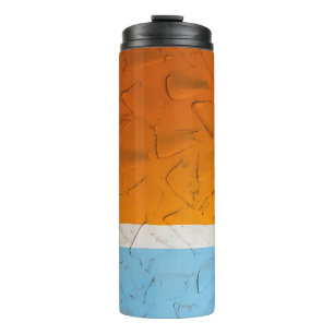Photo of orange, white, and blue artwork thermal tumbler