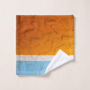 Photo of orange, white, and blue artwork wash cloth