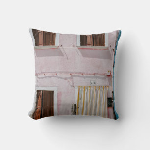 PHOTO OF PINK BUILDING WITH YELLOW DOOR CURTAIN CUSHION