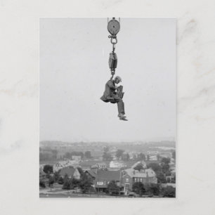 Photographer With Camera Suspended From Hook Postcard