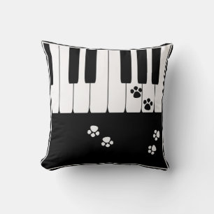 Piano keys and cat feet paws cushion