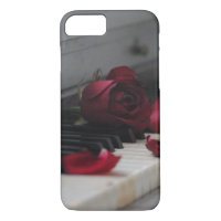 Piano Keys with a Red Rose