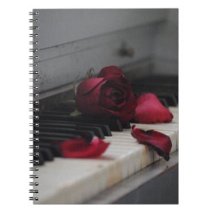 Piano Keys with a Red Rose Notebook