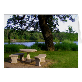 Picnic table summer lunch meeting near the river